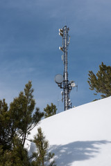 antenna pole in the alps standing in the snow