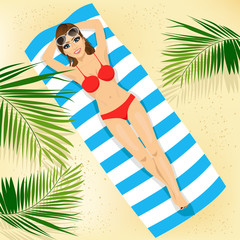 top view of woman with sunglasses in bikini lying on colorful beach towel