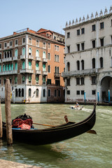 Gondola in Venice on the water with buildings
