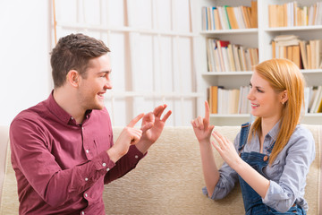 Deaf man with his girlfriend using sign language