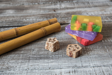 Spa concept. aromatic soaps and bamboo sticks on wooden board