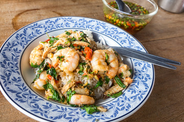 Closeup of Thai's local dish, shrimp stir fried with basil, and fish sauce 