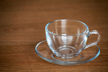 glass cup and saucer