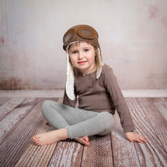 cute little girl-pilot in hat