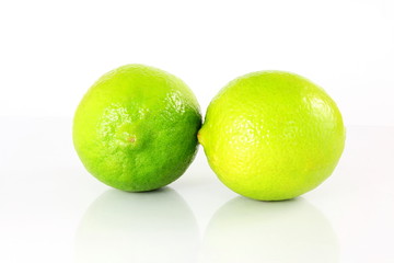 fresh lemon lime citrus fruit  closeup in  white background