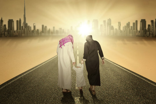 Arabic family walking on the highway