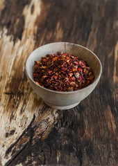 Dry red paprika on a wooden rustic background