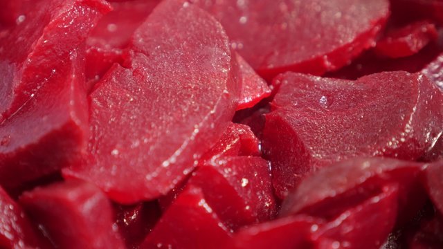 Healthy Beta vulgaris vegetable salad of smaller pieces 4K 3840X2160 UltraHD footage - Beetroot cuts made salad red organic food 4K 2160p 30fps UHD video 