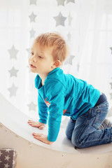 Boy in blue sweater playing the game