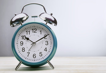 green alarm clock morning wake-up time