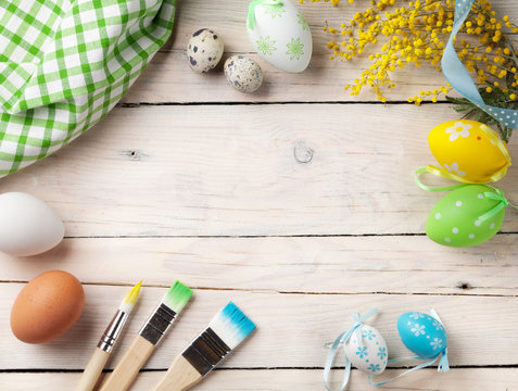 Colorful easter eggs and paint brushes