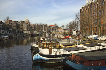 Fototapeta na wymiar Boats in Amsterdam Canal, Holland