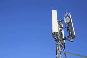 panel antenna mobile communication on background blue sky. telecommunications antenna tripod on the...