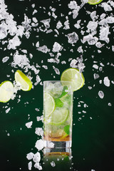 fresh mojito drink with liquid splash, freeze motion.