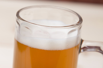 Mug of draft beer close up 