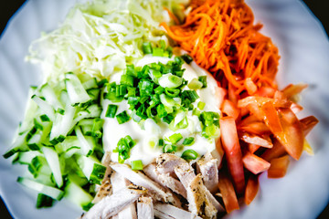 ingredients for the salad, meat, tomatoes carrots, tasty