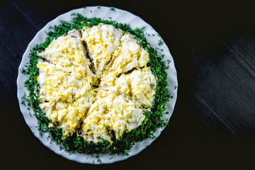 liver cake sprinkled with bits of egg and greens