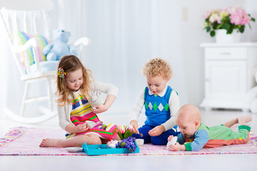 Children playing toy tea party