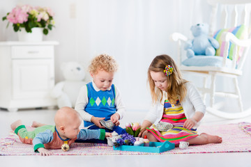 Children playing toy tea party