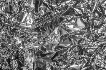 Crumpled silver aluminum foil. View from above.
