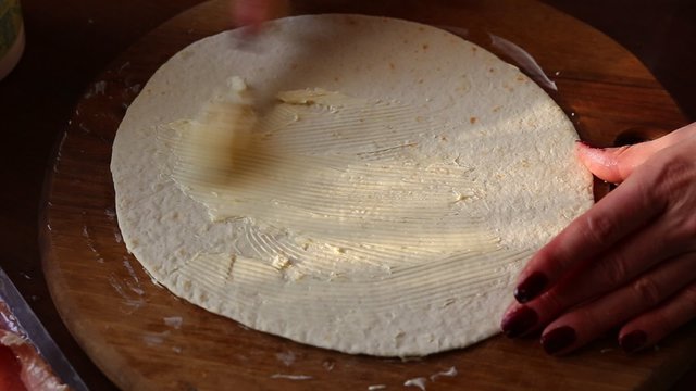 Cooking Mexican tortilla with salmon