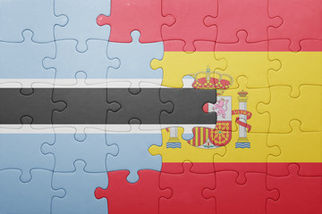 Fototapeta premium puzzle with the national flag of spain and botswana