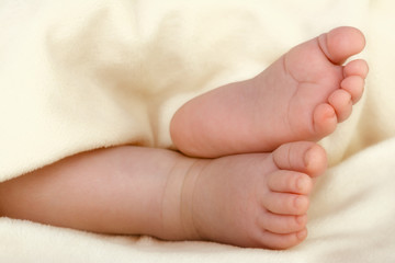 Little feet of a newborn child