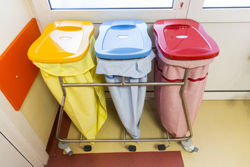 Three recycle bins in a hospital