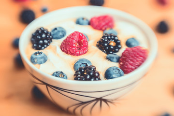Bowl of fresh berries with yogurt