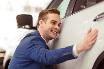 Young businessman in motor show