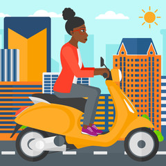 Woman riding scooter.