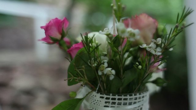 a Small Bouquet of White and Pink Roses