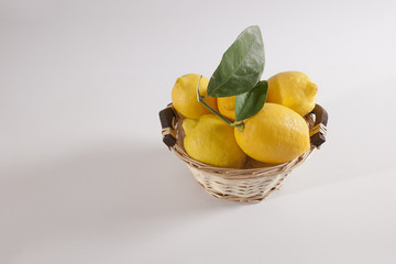 Basket of fresh lemons, overhead view