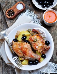 Roast rabbit in white wine with rosemary, olives and capers