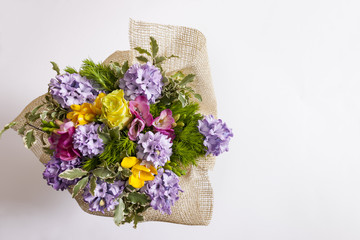 Freesia and hyacinth bouquet seen from above
