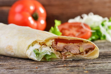 chicken wrap in tortilla with sauce