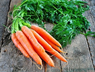 organic carrots on a wooden background