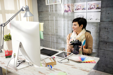 Employed woman working in photo studio.