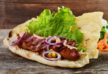 Homemade Bacon Wrapped Hot Dogs with Onions and Peppers