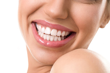 Obraz premium Close up of female face with a clean white teeth