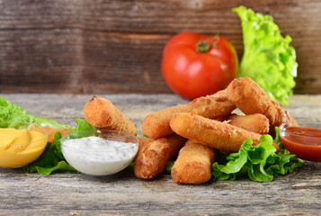 Delicious breaded mozzarella cheese sticks with dipping sauces.
