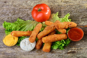 Delicious breaded mozzarella cheese sticks with dipping sauces.