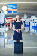 Young female traveler in international airport