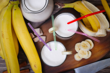 Fresh made Banana smoothie on wooden background