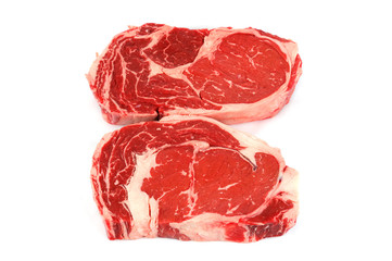 fresh raw rib eye steak on white background