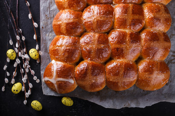 Easter Hot Cross Buns on a dark background.selective focus.