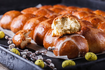 Easter Hot Cross Buns on a dark background.selective focus.