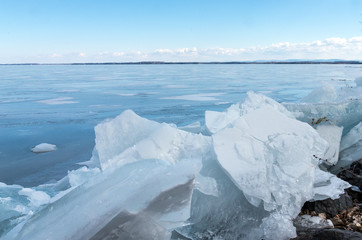 Fototapeta na wymiar Lake Champlain Frozen with broken ice