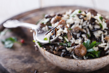 Salad of white and wild rice with mushrooms and herbs.selective focus.