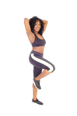 African American woman standing in exercise outfit.